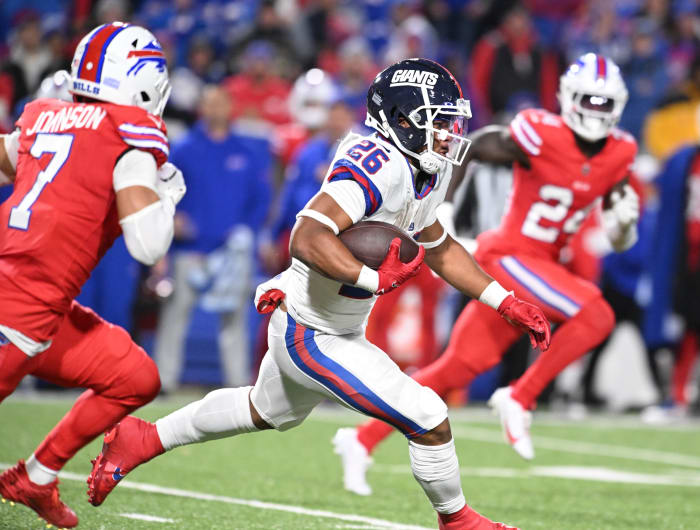Oct 15, 2023; Orchard Park, New York, USA; New York Giants running back Saquon Barkley (26) runs the ball against the Buffalo Bills in the third quarter at Highmark Stadium.